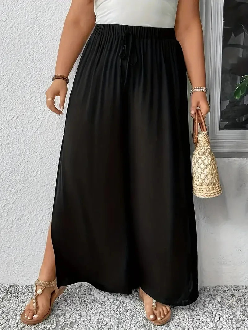 Pantalón holgado, pierna ancha estilo palazzo con abertura